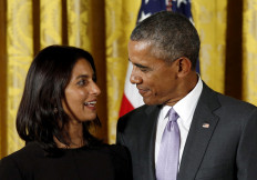 Then US president Barack Obama looks towards author Jhumpa Lahiri while presenting her with the National Humanities Medal during a ceremony at the White House in Washington September 10, 2015.