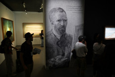 Visitors looks at works on display by Vincent van Gogh at the official unveiling of Christie's new Asia Pacific headquarters at the Henderson Centre in Hong Kong on September 20, 2024. 