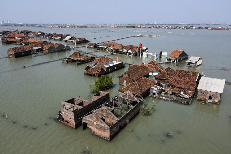 Rising tide: Villagers' homes and the surrounding area of Timbulsloko village in Demak, Central Java, are seen submerged by sea water in this aerial photo taken on June 20, 2023.