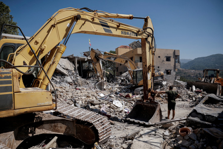 A man pauses amid ongoing search for survivors, a day after an Israeli strike on residential buildings in Maaysrah, north of Beirut, Lebanon, September 26, 2024. 