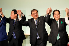 Shigeru Ishiba (center) celebrates after he was elected as the new head of Japan's ruling party at the Liberal Democratic Party's (LDP) leadership election in Tokyo on September 27, 2024.