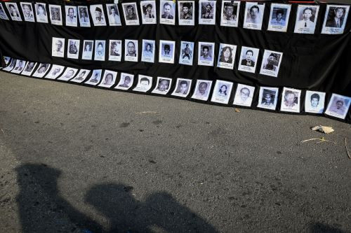 Activists of the Justice for Victims Solidarity Network partake in the Kamisan (Thursday) rally on Sept. 19, 2024 in front of the State Palace in Central Jakarta, to demand the settlement of past human rights violations, including the mass killings following the abortive coup on Sept. 30, 1985 that was blamed on the Indonesian Communist Party (PKI).