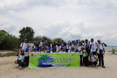 Participants pose on a beach during the Riau edition of the Youth Conservation Trip (#YCTrip), which ran from Sept. 27 to 29, 2024 in Lukit village, Riau province. (Photos courtesy of BRGM)