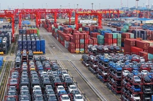 Ready to roll: Carrier frames containing cars are stacked on July 16, 2024 for loading onto ships at Taicang Port in Jiangsu province, China.

