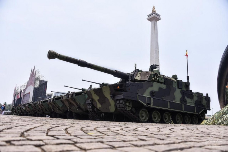 A Harimau medium tank made by state-owned land weapons maker PT Pindad (right) is parked next to Pandur II 8x8 infantry fighting vehicle at the National Monument (Monas) in Central Jakarta on Wednesday, Oct. 2, 2024. Defense Deputy Minister M. Herindra handed over symbolically more than 700 weapons to the Indonesian Military (TNI) commander Gen. Agus Subianto ahead of the TNI 79th anniversary on Saturday, Oct. 5, 2024.