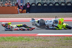 Italian rider Marco Bezzecchi of the Pertamina Enduro VR46 team crashes on Sept. 28, 2024, during the qualifying round of the MotoGP Indonesia 2024 at the Pertamina Mandalika Street Circuit on Lombok, West Nusa Tenggara.