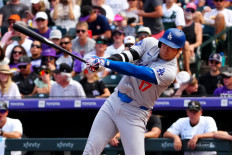 Los Angeles Dodgers two-way player Shohei Ohtani swings the bat in the sixth inning against the Colorado Rockies at Coors Field in Denver, Colorado, the United States on Sept. 29, 2024.