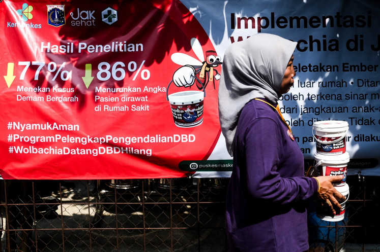 Tackling disease: A health worker carries buckets filled with mosquito eggs infected with Wolbachia bacteria on Oct. 4, 2024, in Kembangan district, West Jakarta. The Jakarta administration released the Wolbachia-infected mosquito eggs in an effort to control the spread of dengue in the city.