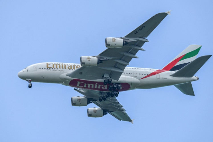 An Emirates Airbus A380 aircraft approaches for landing at Singapore Changi Airport in Singapore on March 24, 2024.