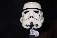 A screen-matched “Move Along“ Sandtrooper Helmet from 'Star Wars: A New Hope' is displayed at Propstore in Chenies, Britain on Sept. 30, 2024.