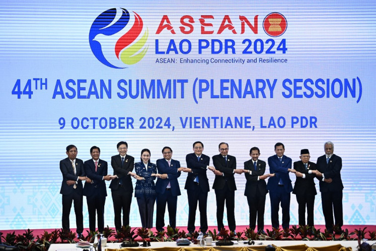 (From left to right) Myanmar's Permanent Secretary of Foreign Affairs Aung Kyaw Moe, Philippines' President Ferdinand Marcos Jr, Singapore's Prime Minister Lawrence Wong, Thailand's Prime Minister Paetongtarn Shinawatra, Vietnam's Prime Minister Pham Minh Chinh, Laos' Prime Minister Sonexay Siphandone, Malaysia's Prime Minister Anwar Ibrahim, Brunei's Sultan Hassanal Bolkiah, Cambodia's Prime Minister Hun Mamet, Indonesia's Vice Prime Minister Ma'ruf Amin and East Timor's Prime Minister Kay Rala Xanana Gusmao pose on stage during the 44th ASEAN Summit in Vientiane on Oct. 9, 2024. (Photo by NHAC NGUYEN / AFP)