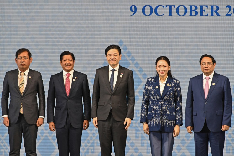 (From left to right) Myanmar's Permanent Secretary of Foreign Affairs Aung Kyaw Moe, Philippines' President Ferdinand Marcos Jr, Singapore's Prime Minister Lawrence Wong, Thailand's Prime Minister Paetongtarn Shinawatra, and Vietnam's Prime Minister Pham Minh Chinh pose for photos during the opening ceremony of the 44th and 45th ASEAN Summits in Vientiane on Oct. 9, 2024.