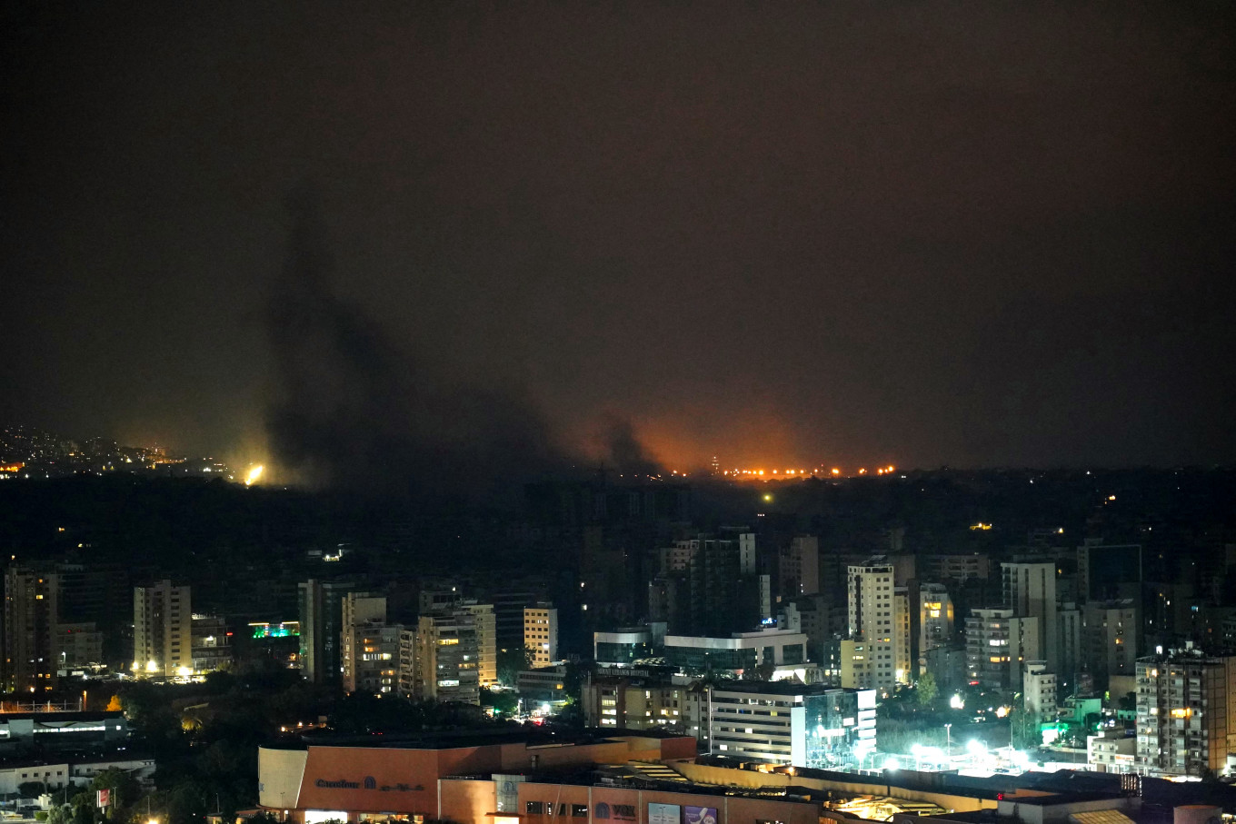 Smoke billows from the site of an Israeli airstrike that targeted a neighborhood in the southern suburbs of Beirut on October 9, 2024.