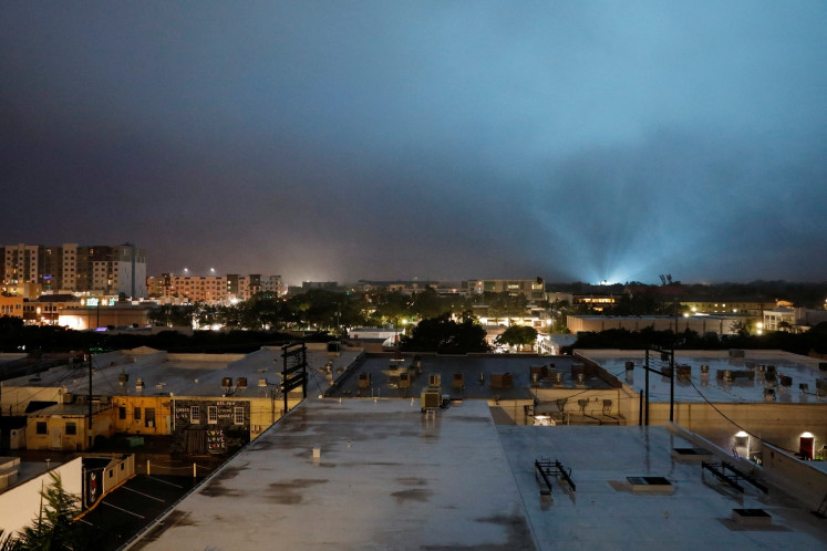 The sky lights up as an electric installation is damaged, while Hurricane Milton approaches Sarasota, Florida, the United States, on Oct. 9, 2024. 