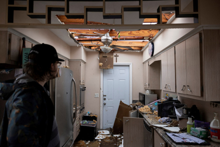 Fort Myers resident Connor Ferin surveys the damage to his destroyed home after a tornado hit the area as Hurricane Milton approaches the city in Florida, the United States, on Oct. 9, 2024.