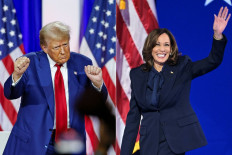 This combination of pictures created on Sept. 9, 2024 shows former United States president and Republican presidential candidate Donald Trump (left) dancing as he leaves the stage after speaking alongside former US Representative Tulsi Gabbard during a town hall meeting in La Crosse, Wisconsin, on August 29, 2024 and US Vice President and Democratic presidential candidate Kamala Harris arriving onstage to speak on the fourth and last day of the Democratic National Convention (DNC) at the United Center in Chicago, Illinois, on Aug. 22, 2024. Kamala Harris and Donald Trump are entering the final one-month sprint to the most dramatic US presidential election in modern history, with both candidates warning the fate of a divided nation hangs on a result that is still too close to call.