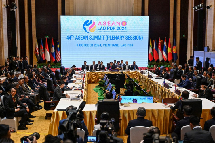 Laos' Prime Minister Sonexay Siphandone (center) and ASEAN leaders take part in the 44th ASEAN Summit in Vientiane, Laos on Oct. 9, 2024.