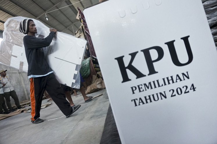 Workers move ballot boxes that will be used for the 2024 simultaneous regional elections at a warehouse of the Batang General Elections Commission (KPU) in Central Java on Oct. 10, 2024.