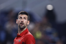 Serbia's Novak Djokovic reacts during his Shanghai Masters quarter final match against Czech Republic's Jakub Mensik at the Qizhong Forest Sports City Arena in Shanghai, China on Oct. 11, 2024.