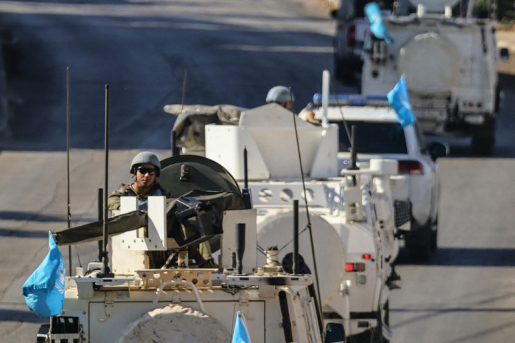 Vehicles from the United Nations Interim Force in Lebanon (UNIFIL) patrol in Marjayoun in southern Lebanon on Oct. 12, 2024. UNIFIL, which says it has come under repeated fire in the Israeli-Hezbollah war in recent days, has patrolled the troubled border for decades.