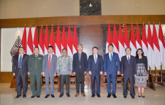 Chinese ambassador-designate to Indonesia Wang Lutong (center) poses after arriving in Jakarta on Oct. 12, 2024.