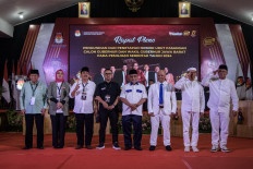 Vying to lead: West Java gubernatorial candidate pairs (from left to right) Acep Adang Ruhiat-Gitalis Dwinatarina, Jeje Wiradinata-Ronal Surapradja, Ahmad Syaikhu-Ilham Habibie and Dedi Mulyadi-Erwan Setiawan pose for a photo during the ballot number drawing ceremony at the West Java General Elections Commission (KPU) office in Bandung, West Java, on Sept. 23.