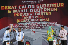 Banten gubernatorial candidate pairs (from left) Andra Soni-Achmad Dimyati Natakusumah and Airin Rachmi Diany-Ade Sumardi attend the first gubernatorial debate on Oct. 16, 2024, in Jakarta.