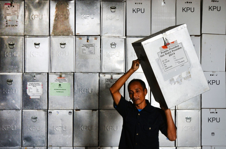 An election official moves a ballot box on Feb. 28, 2020, from the Ciamis Regional Elections (Pilkada) logistics warehouse in Ciamis regency, West Java. 