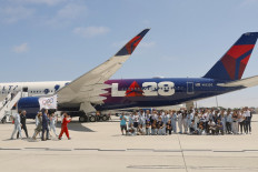 Team USA athletes greet Los Angeles Mayor Karen Bass and the LA28 team as the Olympic Flag arrives in Los Angeles, the United States on Aug. 12, 2024.