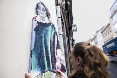 French street artist pays tribute to victim in mass rape trial