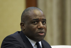 Britain's Foreign Secretary David Lammy attends a meeting with Chinese Vice Premier Ding Xuexiang (not pictured) at the Great Hall of the People in Beijing on October 18, 2024. 