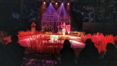 Audience members at the open-air amphitheater of the NuArt Sculpture Park in Bandung watch Ariel Tatum sing and dance during the “Sang Kembang Bale” show.