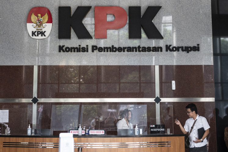 Pushing back: A receptionist talks to a visitor on Oct. 21, 2024, at the lobby of the Corruption Eradication Commission (KPK) headquarters in Jakarta. President Prabowo Subianto has asserted his commitment to fighting corruption through system overhaul, digitalization and assertive law enforcement.