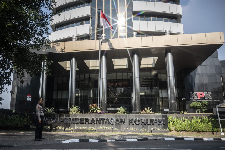 Keeping watch: A police officer stands guard in front of the Corruption Eradication Commission (KPK) headquarters in Jakarta in this file picture. 