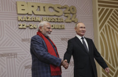 Russian President Vladimir Putin greets Indian Prime Minister Narendra Modi during a welcoming ceremony for participants of the BRICS summit in Kazan on October 22, 2024. (AFP/MAXIM SHIPENKOV).
Usage: 0