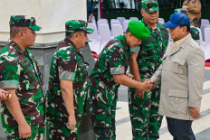 High hopes: President Prabowo Subianto (right) greets Army officers as he arrives at the Military Academy to attend their cabinet retreat in Magelang, Central Java, on Oct. 24.