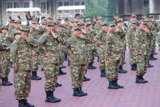 President Prabowo Subianto (front, third left) attends a warm-up session during the retreat with members of his Red and White Cabinet at the Military Academy in Magelang, Central Java, on Oct. 25, 2024. 