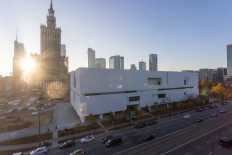 The new building of Warsaw Museum of Modern Art is seen over the street with the Soviet era Palace of Culture and Warsaw's downtown skyline in background in the Polish capital of Warsaw on Oct. 25, 2024.
