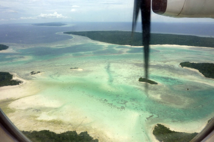This aerial file picture taken on January 25, 2011, show islands and reefs in Wakatobi archipelago, a thriving marine paradise in Southeast Sulawesi packing a bewildering abundance of life in the Coral Triangle, a region of rich tropical reefs spanning much of Southeast Asia and almost all of Indonesia. 