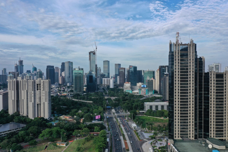 High-rise buildings are seen in Sudirman Central Business District in South Jakarta on March 14, 2021. 