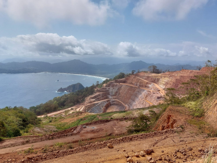 Low clouds pass on Oct. 25, 2024, over the Tujuh Bukit gold mine operated by PT Merdeka Copper Gold subsidiary PT Bumi Suksesindo in Banyuangi, East Java.