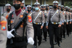 East Java Police personnel attend the 76th anniversary of the National Police on Jul. 5, 2022, in Surabaya, East Java. 