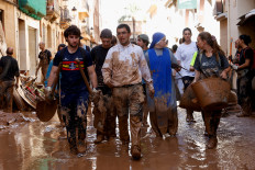 Volunteers bring ray of light to Spanish towns shattered by floods
