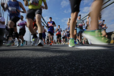 Runners cross the Verrazano Bridge before competing in the 52nd Edition of the New York City Marathon on Nov. 5, 2023.