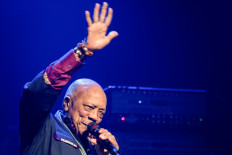 US producer Quincy Jones waves on stage during the 53rd Montreux Jazz Festival on June 30, 2019 in Montreux.