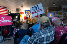 People listen as Republican senate candidate Dave McCormick speaks at a campaign rally on October 30, 2024 in Pennsburg, Pennsylvania, US.