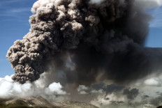 Mount Lewotobi Laki-laki on Flores Island erupts with a great cloud of gray ash on Nov. 7, 2024, as seen from Lewolaga village in East Flores, East Nusa Tenggara.