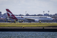 Qantas plane returns to Australia airport due to 'engine failure', sparks fire