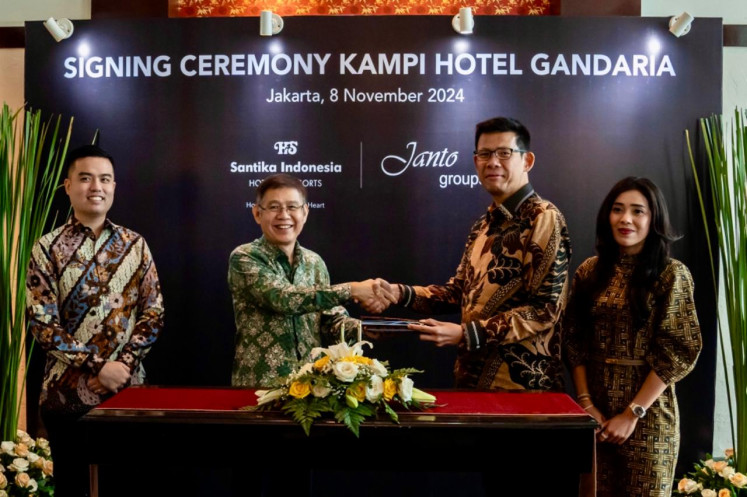 Executives of Santika Hotels and Resorts and Janto Group sign an agreement in Jakarta on Nov. 8, 2024, on the establishment of a new Kampi Hotel in the capital city's Gandaria area.