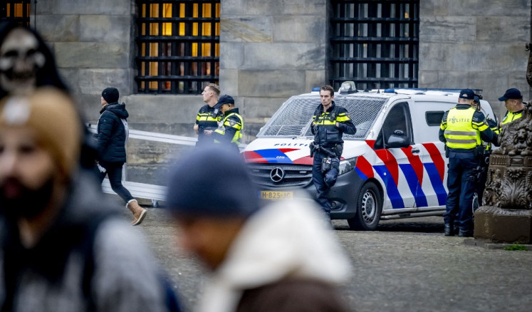 Netherlands' Police officers patrol on Dam Square in Amsterdam, on November 9, 2024. Extra security measures were taken in Amsterdam following violent clashes on November 7, 2024, between fans of Ajax, Maccabi Tel Aviv and Turkish club Fenerbahce, who were playing another Dutch club, AZ Alkmaar. The city has a introduced a temporary ban on demonstrations throughout the capital this weekend and has also been designated a security risk area. 